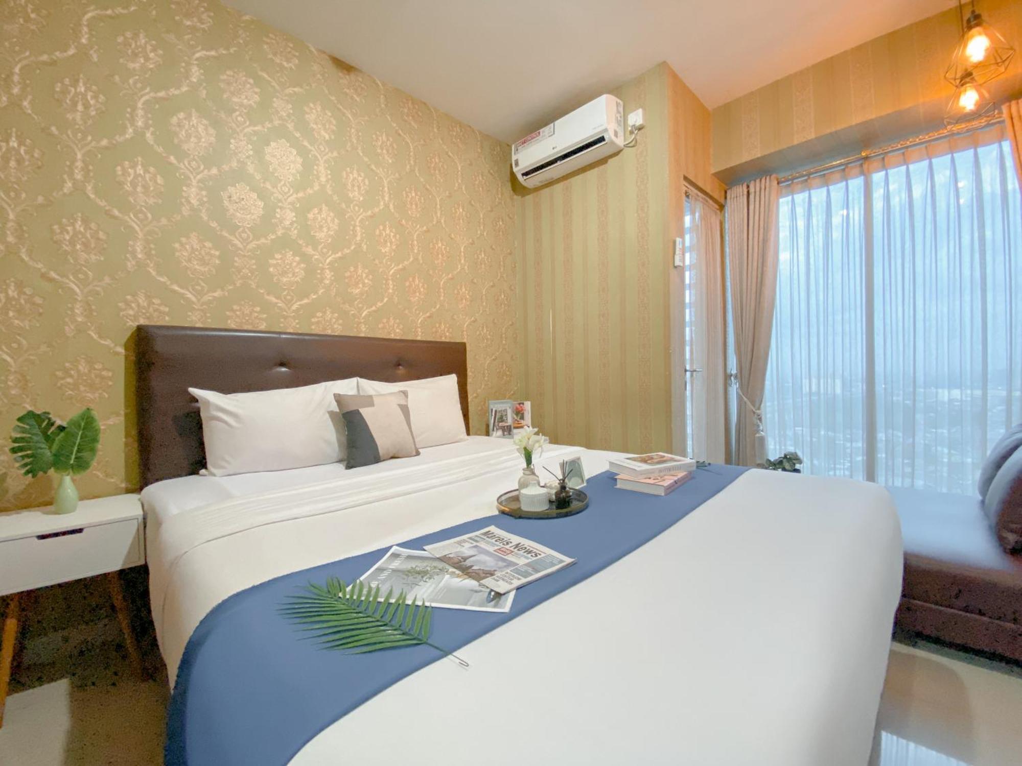 Apartemen Cozy Grand Kamala Lagoon By Travelio