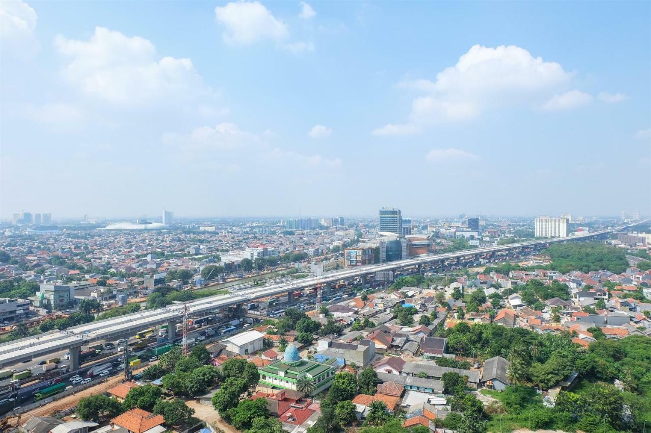 Apartemen Cozy Grand Kamala Lagoon By Travelio